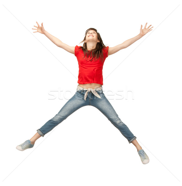 jumping teenage girl Stock photo © dolgachov