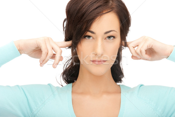 woman with fingers in ears Stock photo © dolgachov