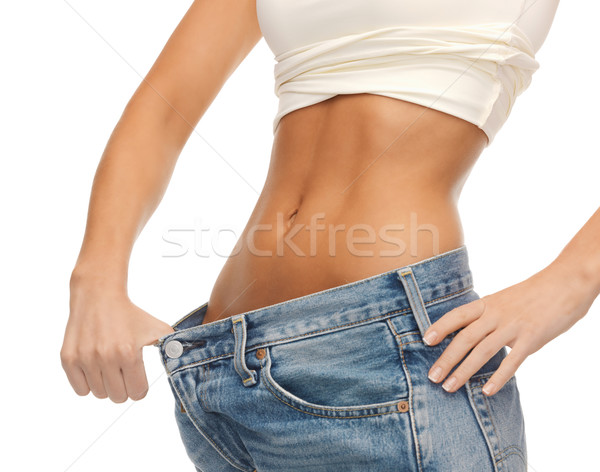 woman showing big pants Stock photo © dolgachov