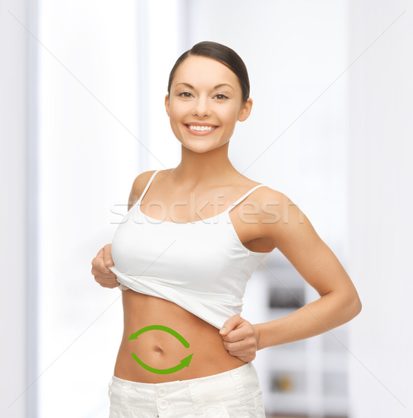 woman with arrows on her stomach Stock photo © dolgachov