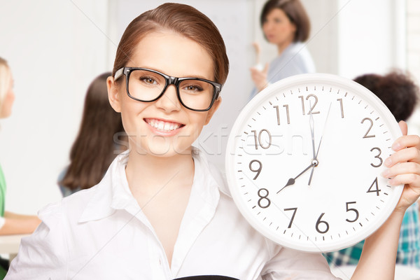 student showing clock Stock photo © dolgachov