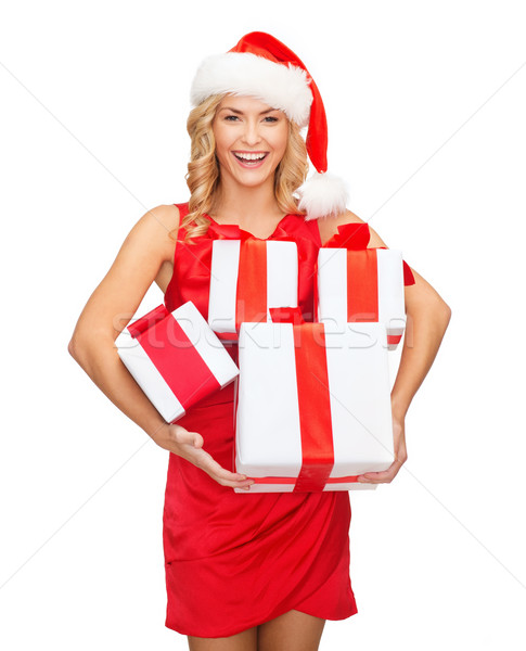 woman in santa helper hat with many gift boxes Stock photo © dolgachov