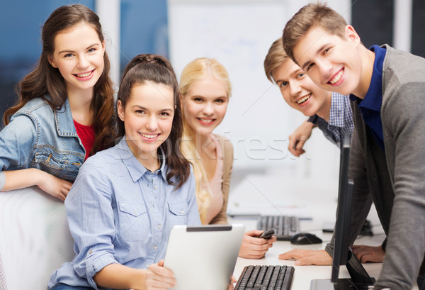 Stock photo: students with computer monitor and tablet pc