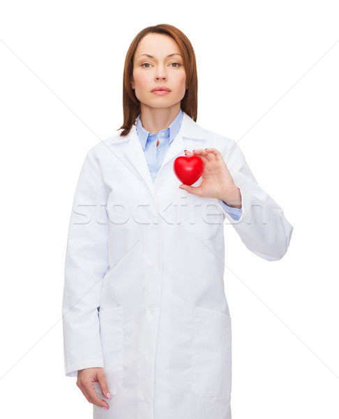 serious female doctor with heart Stock photo © dolgachov