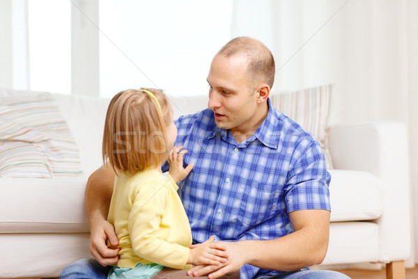 Stock photo: smiling father and daughter playing at home