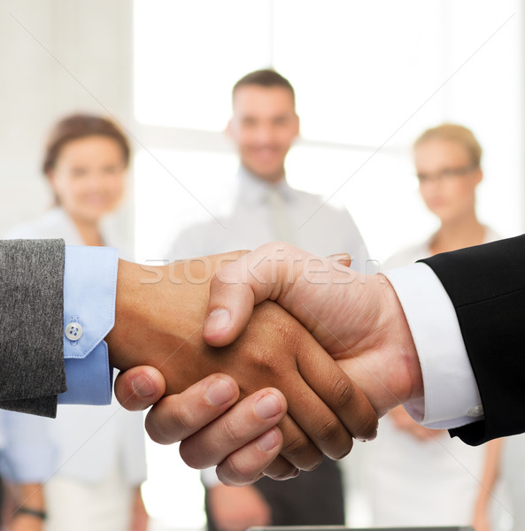 businessman and businesswoman shaking hands Stock photo © dolgachov