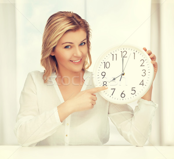 woman with clock Stock photo © dolgachov