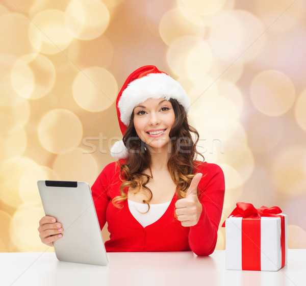 Femme souriante chapeau cadeau Noël [[stock_photo]] © dolgachov