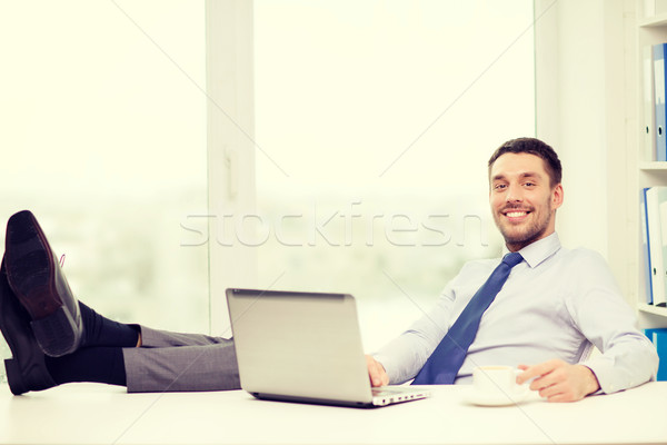 Stock photo: smiling businessman or student with laptop