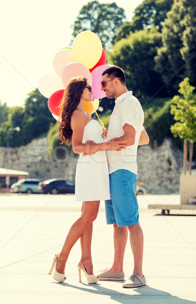 smiling couple in city Stock photo © dolgachov