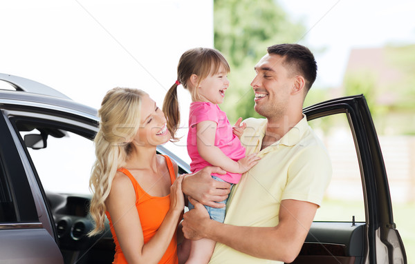 happy family with child laughing at car parking Stock photo © dolgachov