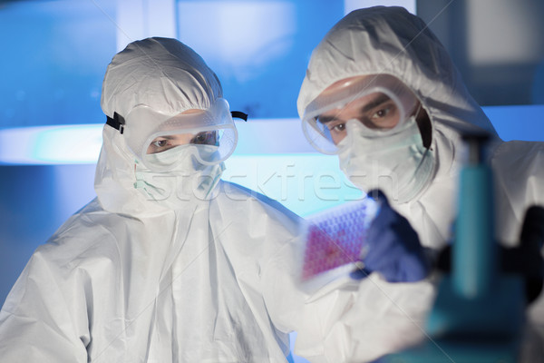 close up of scientists making test in chemical lab Stock photo © dolgachov