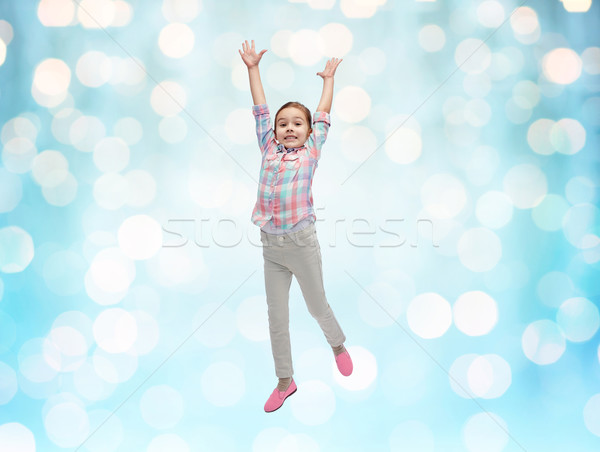 Stockfoto: Gelukkig · meisje · springen · lucht · Blauw · lichten