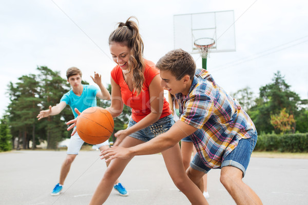 Groupe heureux adolescents jouer basket vacances d'été [[stock_photo]] © dolgachov