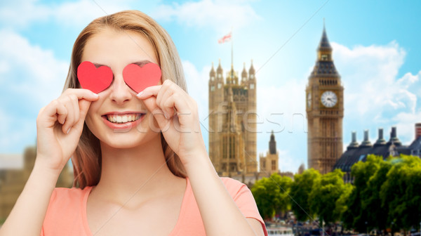 happy young woman with red heart shapes on eyes Stock photo © dolgachov
