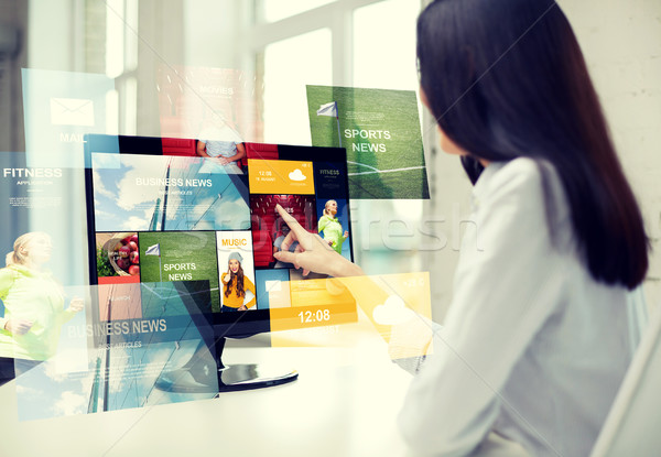 close up of woman with news on computer in office Stock photo © dolgachov