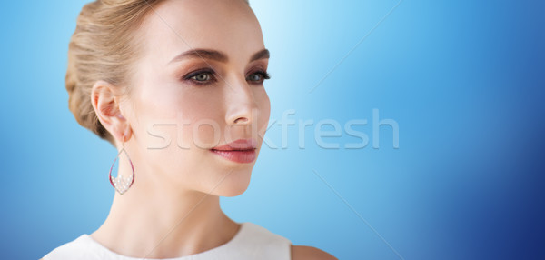 Stock photo: smiling woman in white dress with pearl jewelry