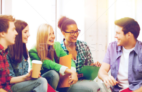 Stock photo: students communicating and laughing at school