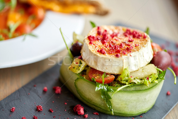 goat cheese salad with vegetables at restaurant Stock photo © dolgachov