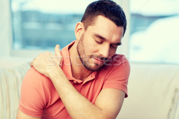 Unglücklich Mann Leiden Nackenschmerzen home Menschen Stock foto © dolgachov