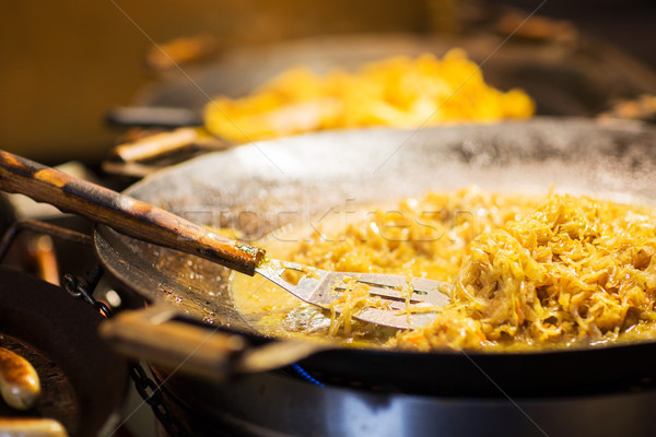 braised cabbage or sauerkraut in wok or frying pan Stock photo © dolgachov