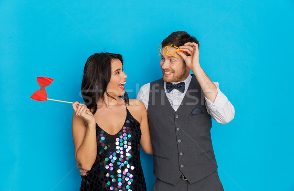 happy couple with party props having fun Stock photo © dolgachov