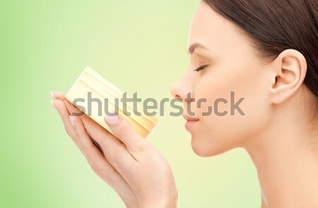 beautiful woman with moisturizing creme Stock photo © dolgachov
