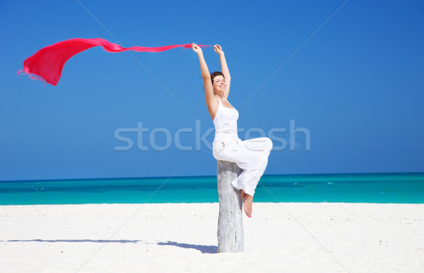 happy woman with red sarong Stock photo © dolgachov