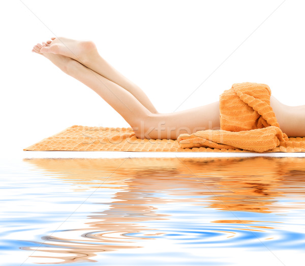 Longues jambes dame orange serviette sable blanc [[stock_photo]] © dolgachov