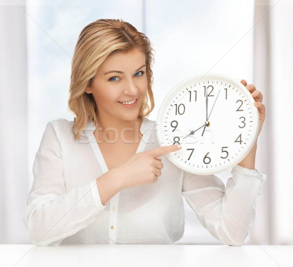 woman with clock Stock photo © dolgachov