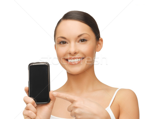 woman pointing at smartphone with sport app Stock photo © dolgachov