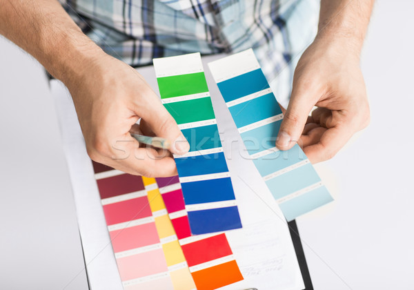 man with color samples for selection Stock photo © dolgachov