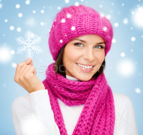 woman in hat and muffler with big snowflake Stock photo © dolgachov