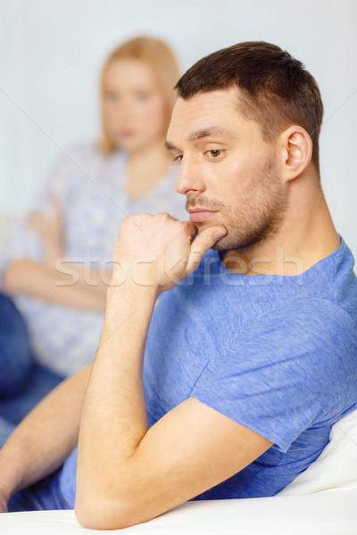 upset young man with man on the back at home Stock photo © dolgachov