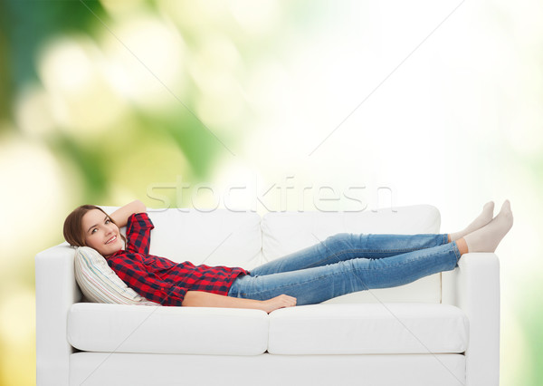 Mosolyog tinilány kanapé otthon szabadidő boldogság Stock fotó © dolgachov