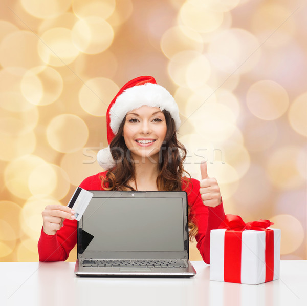 Сток-фото: улыбающаяся · женщина · кредитных · карт · ноутбука · Рождества · праздников · технологий