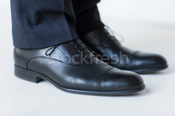 close up of man legs in elegant shoes with laces Stock photo © dolgachov