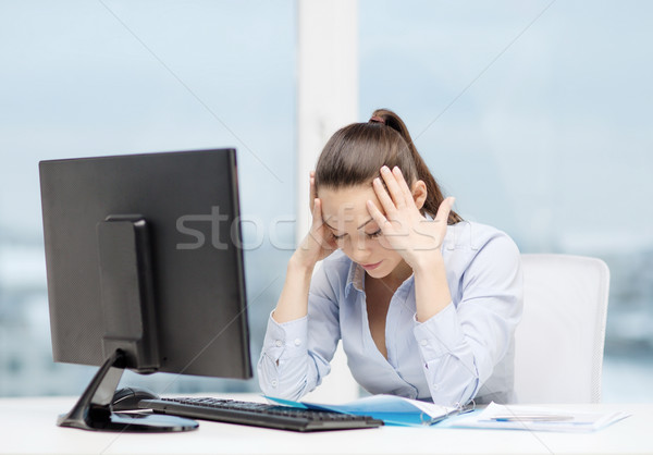stressed woman with computer and documents Stock photo © dolgachov