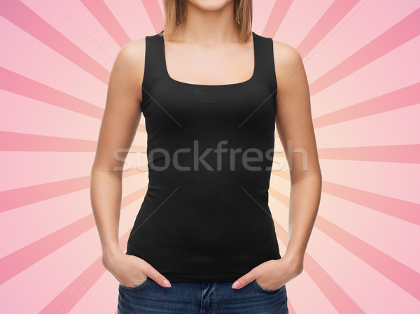 close up of woman in blank black tank top Stock photo © dolgachov