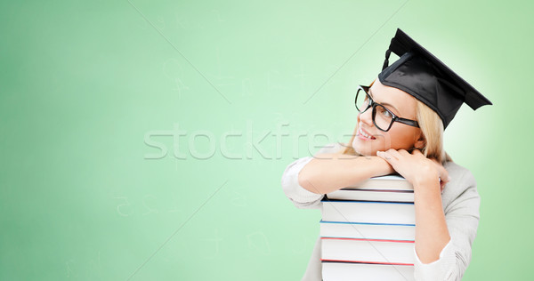 Boldog diák tábla sapka könyvek oktatás Stock fotó © dolgachov