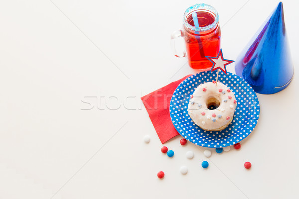 donut with juice and candies on independence day Stock photo © dolgachov