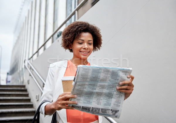 happy african businesswoman with coffee in city Stock photo © dolgachov