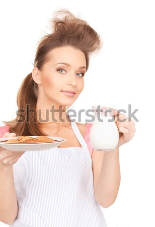 housewife with milk and cookies Stock photo © dolgachov