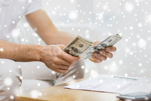 close up of man hands counting money at home Stock photo © dolgachov
