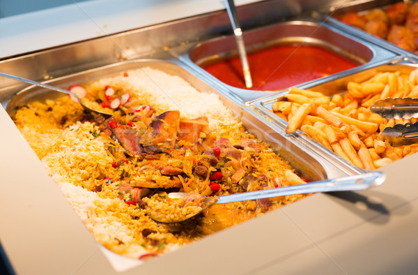 close up of rice pilaf and other dishes on tray Stock photo © dolgachov