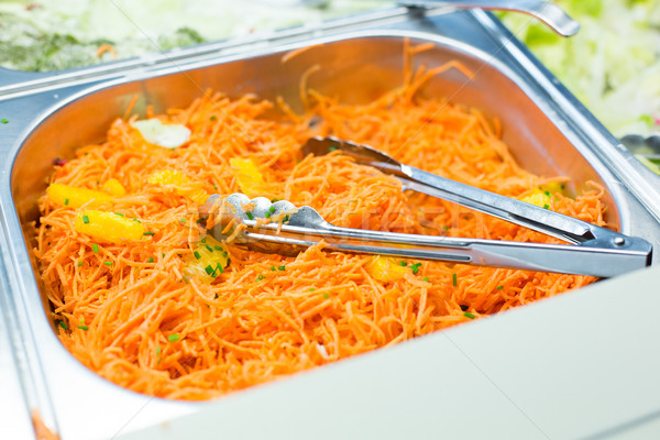 close up of spicy korean carrot salad in container Stock photo © dolgachov