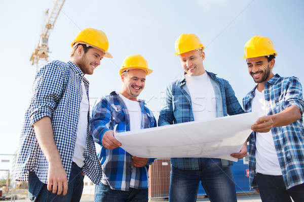 Stock photo: group of builders with tablet pc and blueprint