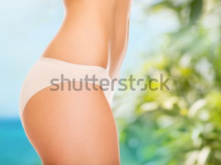 close up of young woman buttocks in pink bikini Stock photo © dolgachov