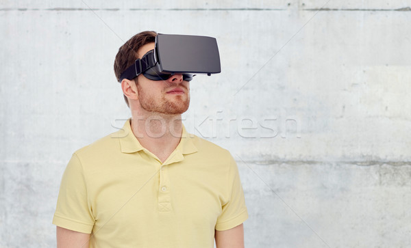 man in virtual reality headset or 3d glasses Stock photo © dolgachov