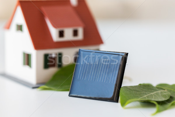 close up of house model and solar battery or cell Stock photo © dolgachov